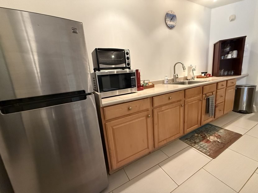 The Sunrise kitchenette counter from the side, running past the sink to the cabinets at the far end.